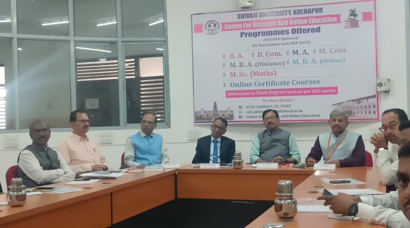 Dr. Madhukar Vavare, Joint Secretary of the UGC Distance Education Department, provided guidance on self-study material development at Shivaji University.